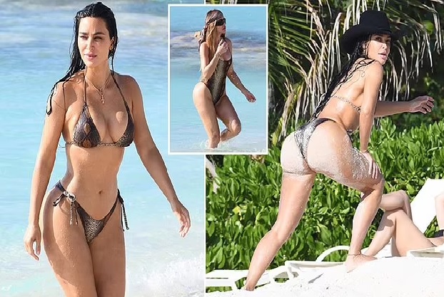 EXCLUSIVE: Bikini-clad Kim Kardashian and sister Khloe put their famous curves on full display in sexy swimsuits at the beach in Turks and Caicos