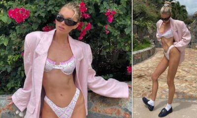 Elsa Hosk flaunts her very toned figure in a chic bikini and oversized pink blazer while on vacation