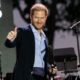 Breaking News: Prince Harry Takes Stage at Concert—But I Can’t Get Over What’s Around His Neck (and Its Connection to William)...see more